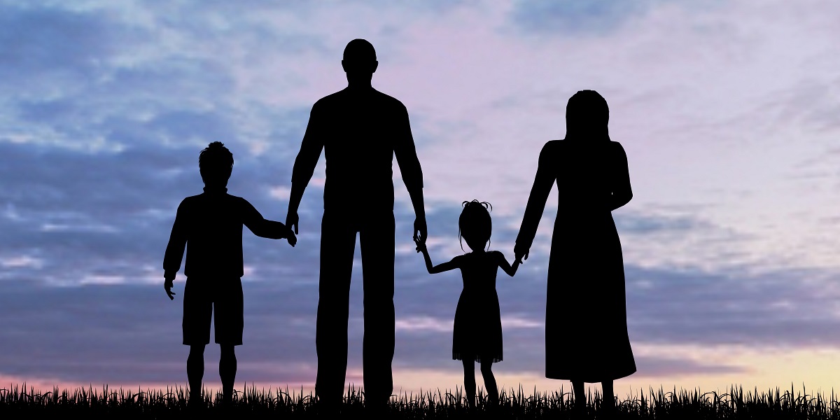 Silhouettes of refugee family - mother, father and two children.